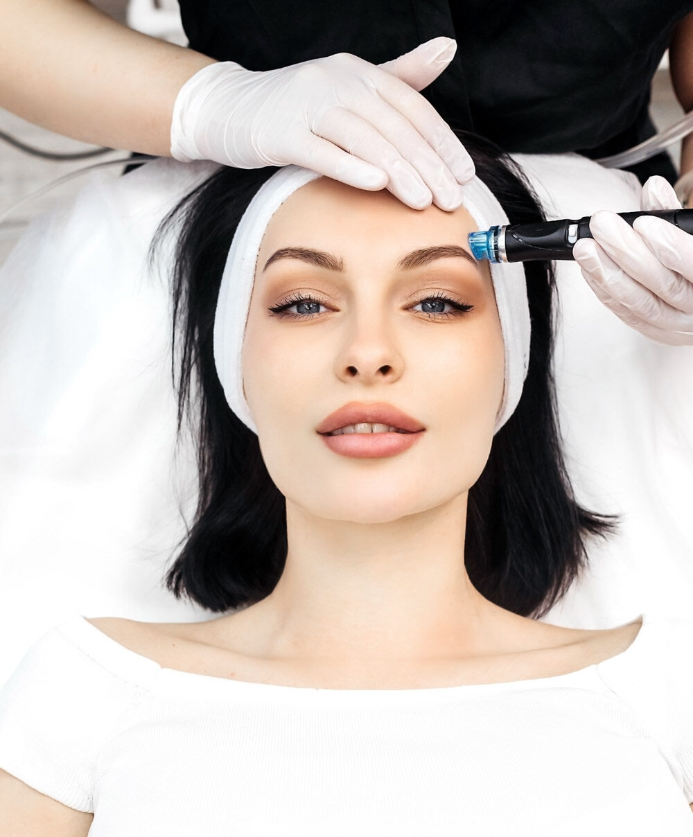 A woman receiving a hydrafacial