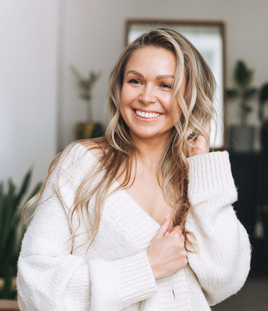 A woman smiling at home