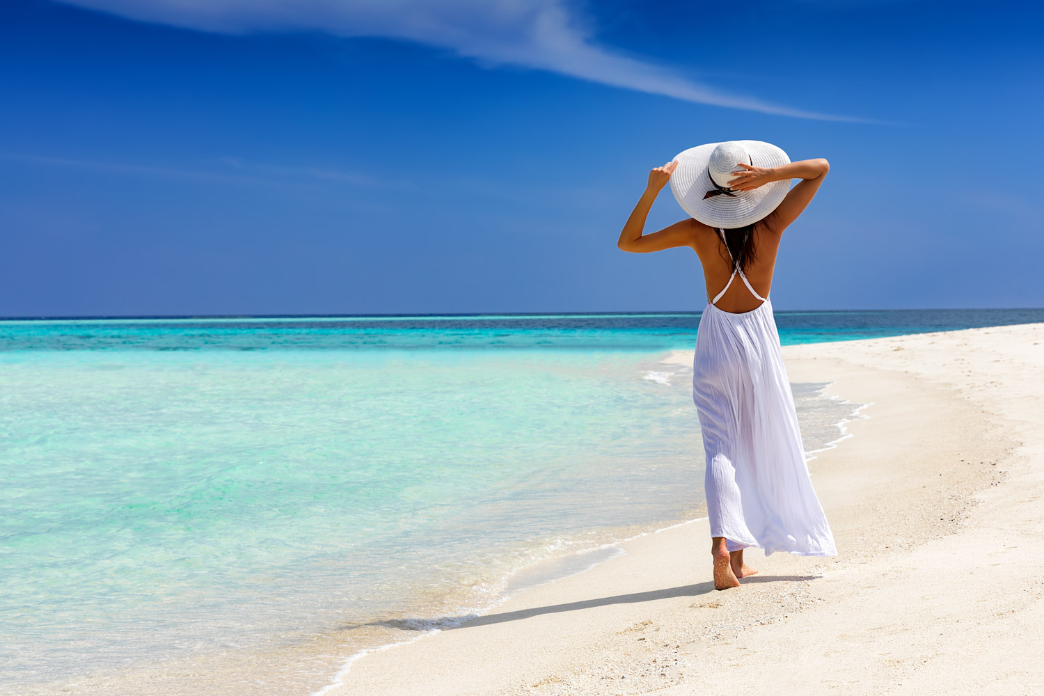 MedSpa Hair Removal-3 A smiling woman stand on the beach