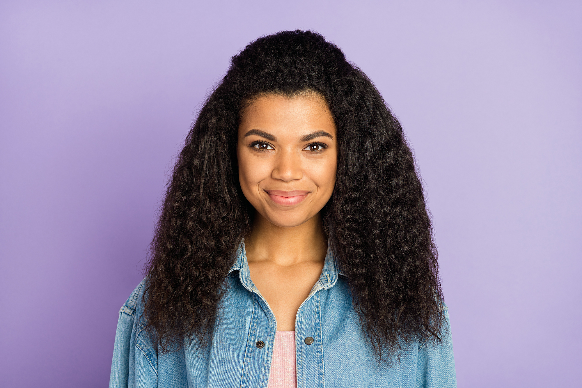 An African-American woman smiles at the camera