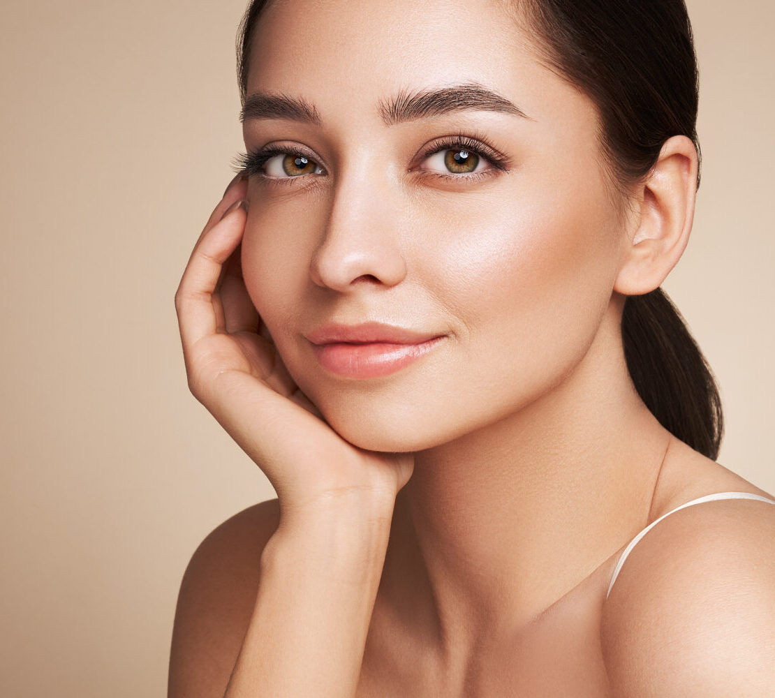 A woman smiles at the camera